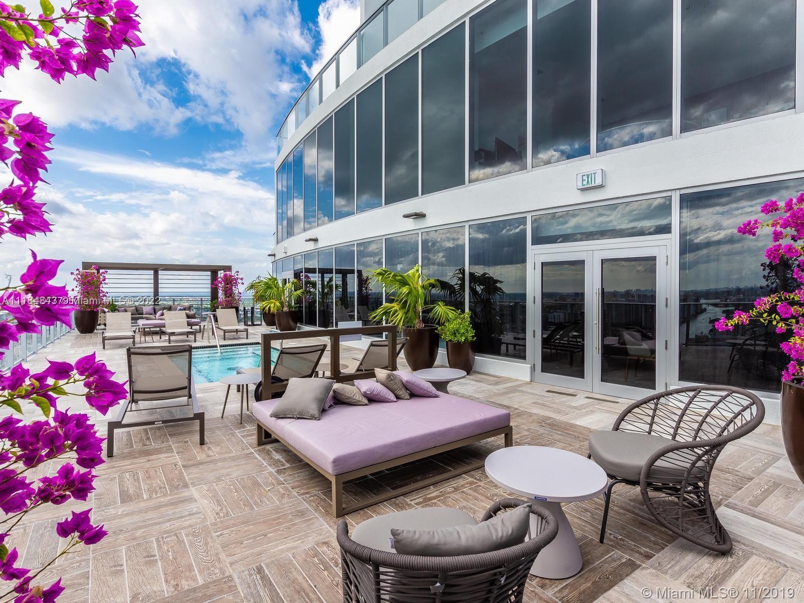 4010 South Ocean Drive, Unit R1405 Hollywood, FL 33019 - Photo 38 of 67 a view of a patio with couches table and chairs and potted plants