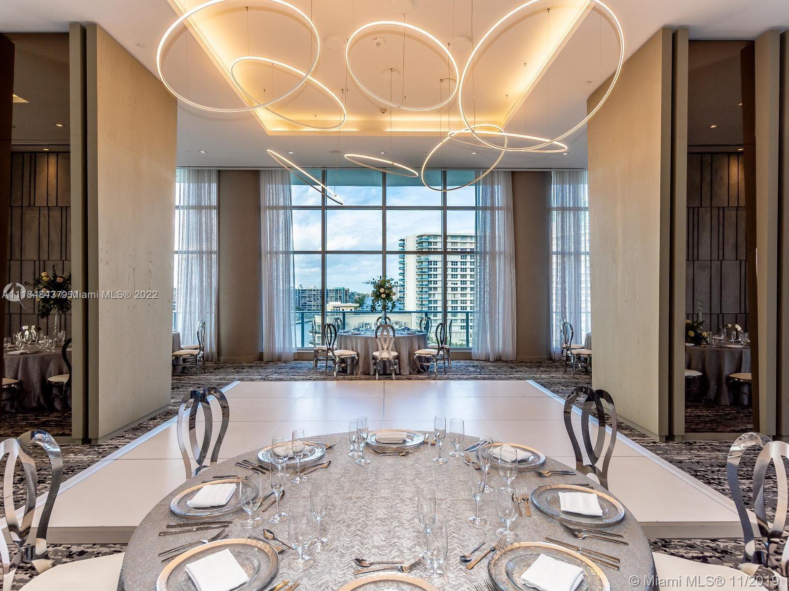 4010 South Ocean Drive, Unit R1405 Hollywood, FL 33019 - Photo 48 of 67 a room with lots of windows and glass windows