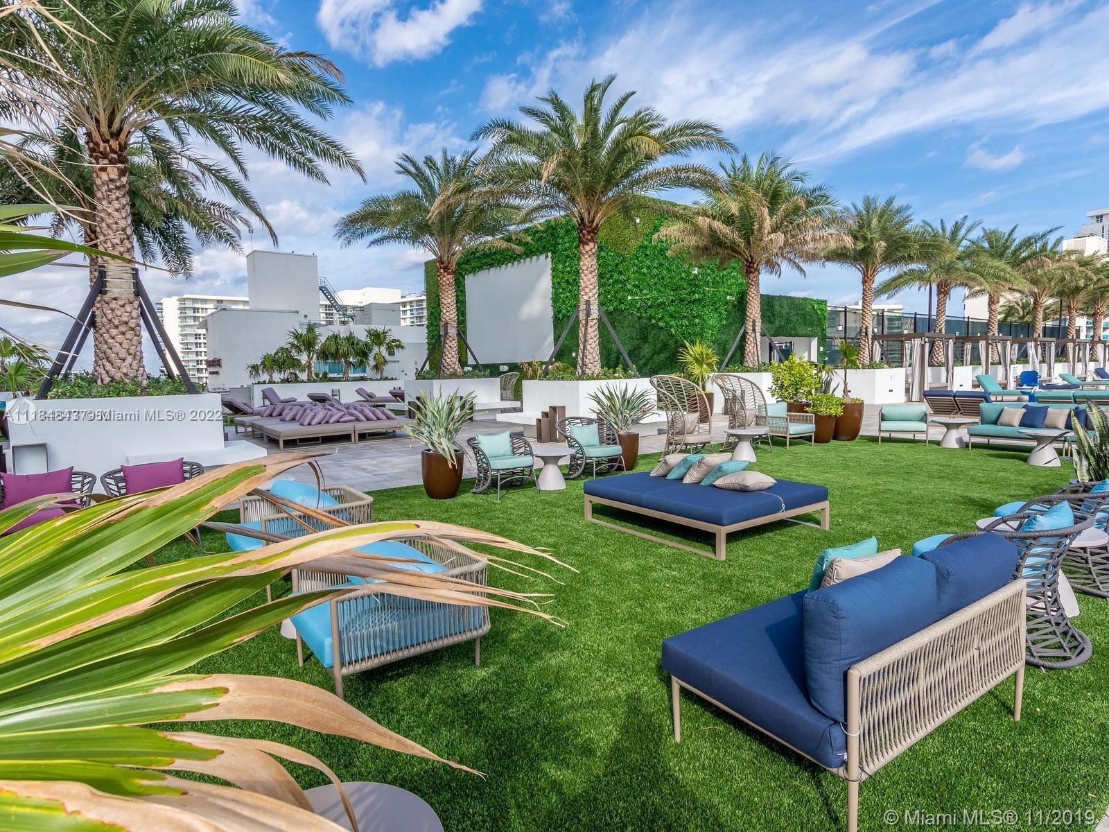 4010 South Ocean Drive, Unit R1405 Hollywood, FL 33019 - Photo 60 of 67 a view of a backyard with plants and outdoor seating