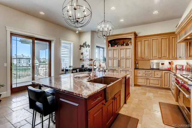 a living room with furniture large window and a fireplace