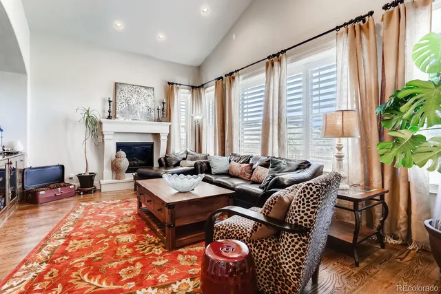 a bedroom with furniture and a wooden floor