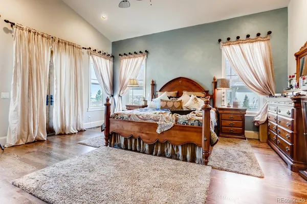 a spacious bathroom with a tub sink and mirror
