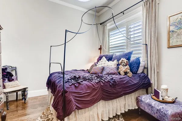 a living room with furniture and a book shelf