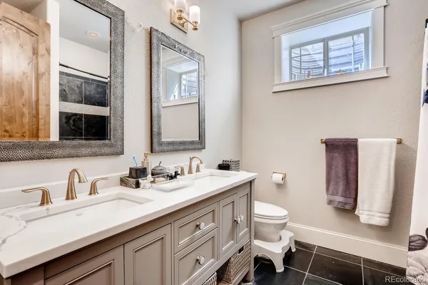 a view of a patio with dining table and chairs