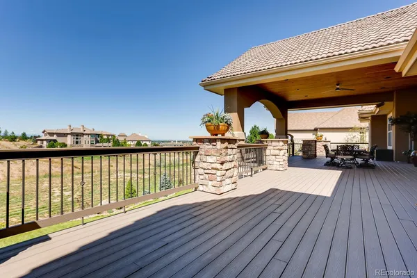 a view of a balcony with lake view and wooden floor