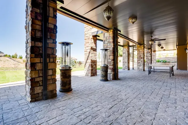 a front view of a house with yard patio and fire pit