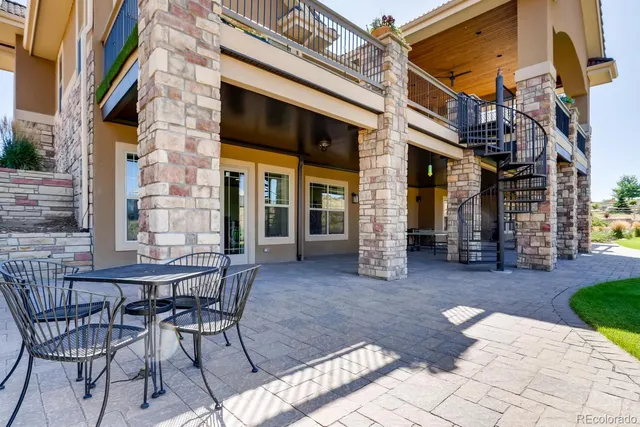 an aerial view of a house with a garden and trees