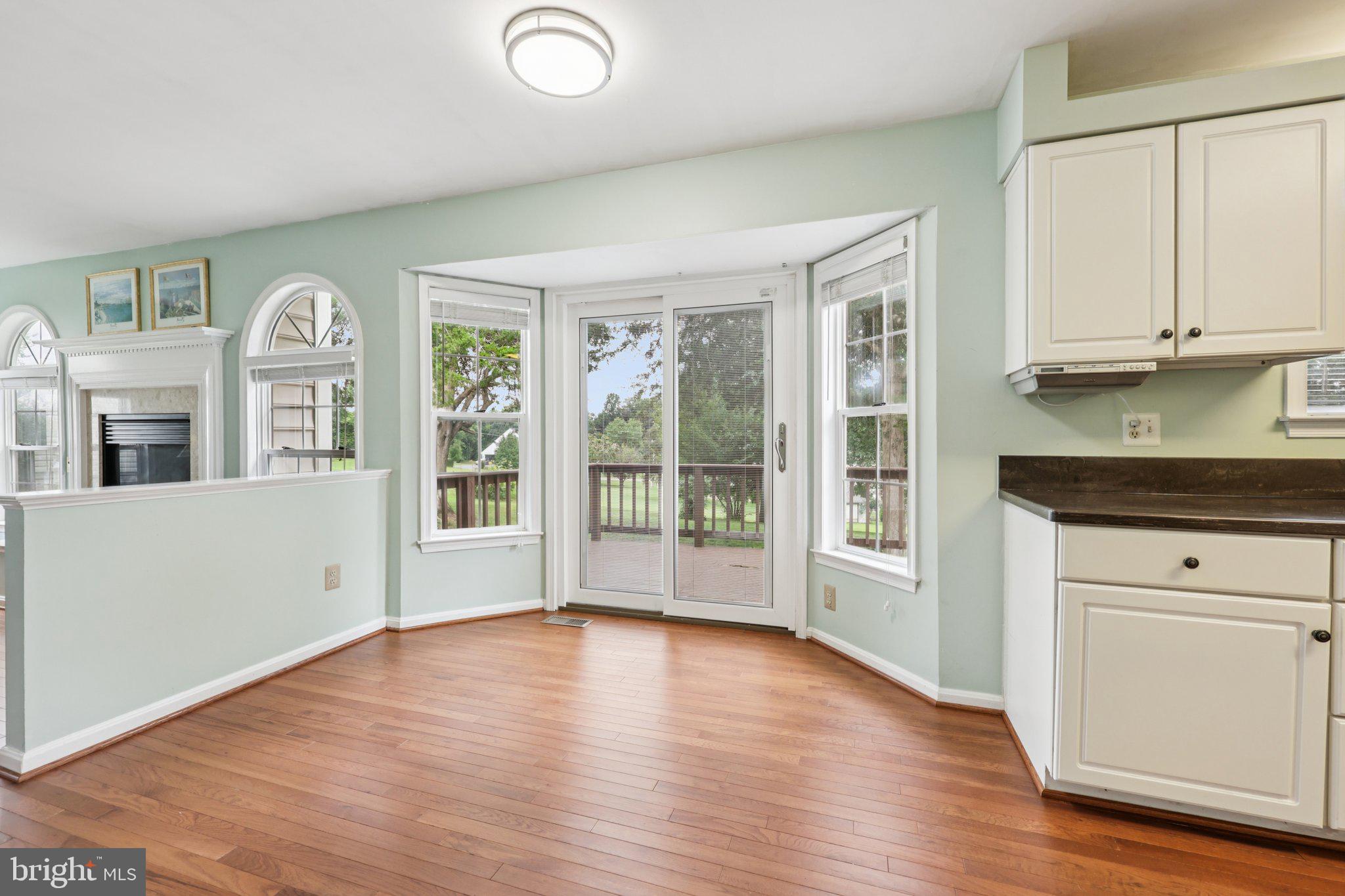 10457 Pineview Road Manassas, VA 20111 - Photo 11 of 55 a view of an empty room with window and wooden floor