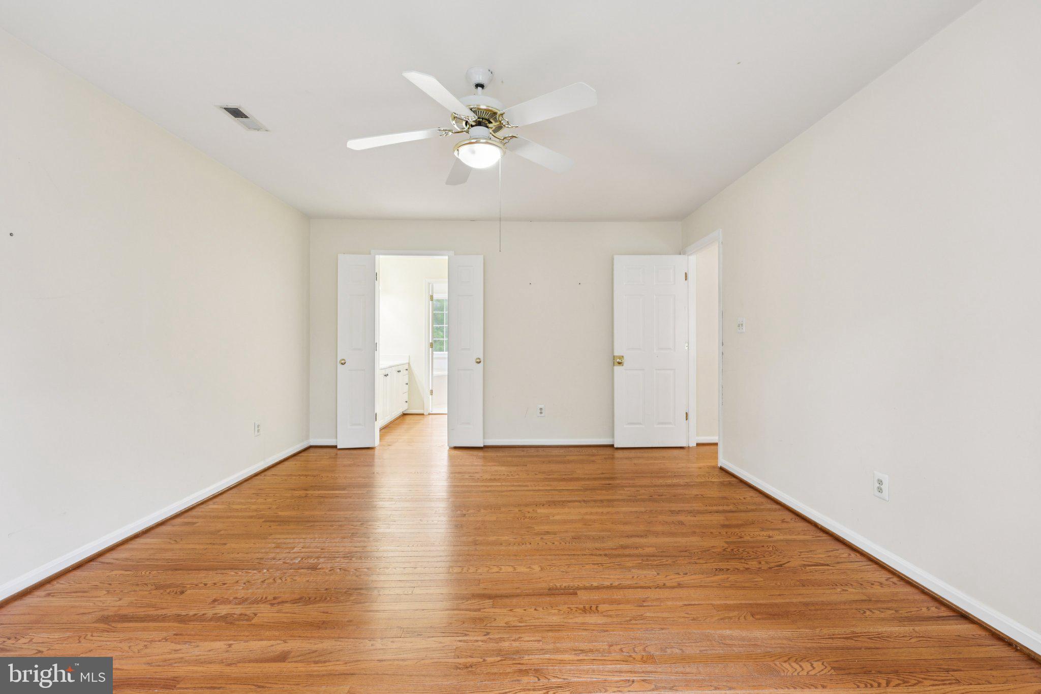 10457 Pineview Road Manassas, VA 20111 - Photo 18 of 55 a view of an empty room with wooden floor
