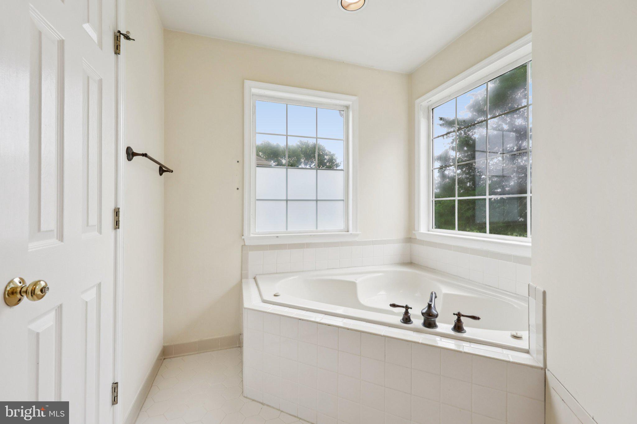 10457 Pineview Road Manassas, VA 20111 - Photo 21 of 55 a white bath tub sitting next to a window