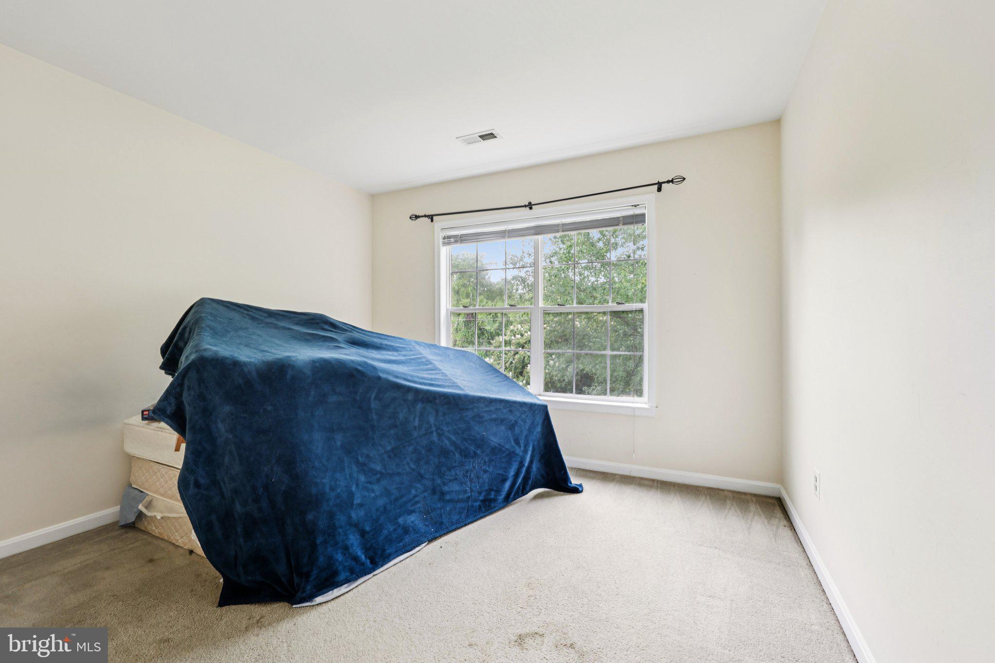 10457 Pineview Road Manassas, VA 20111 - Photo 25 of 55 a bedroom with a bed and a window