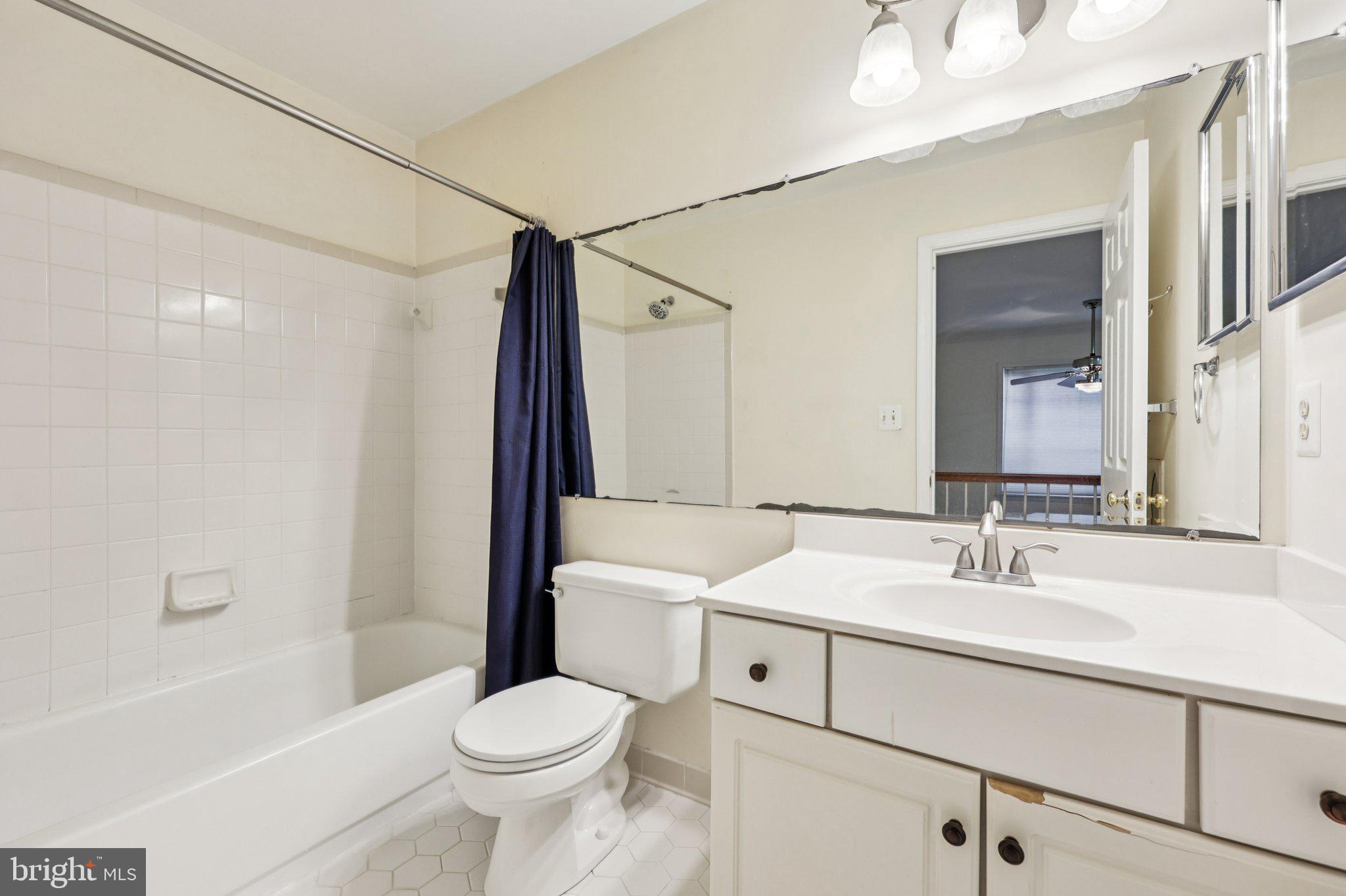 10457 Pineview Road Manassas, VA 20111 - Photo 27 of 55 a bathroom with a sink toilet and shower