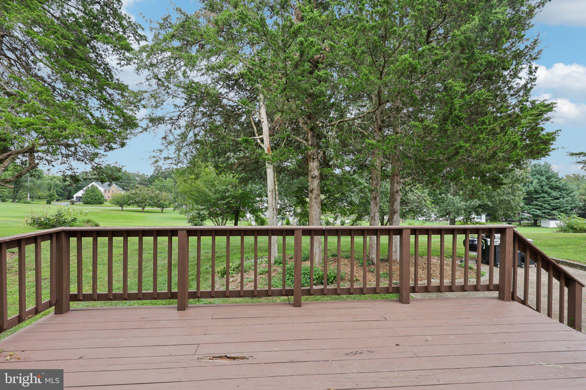 10457 Pineview Road Manassas, VA 20111 - Photo 37 of 55 a view of wooden deck and a garden