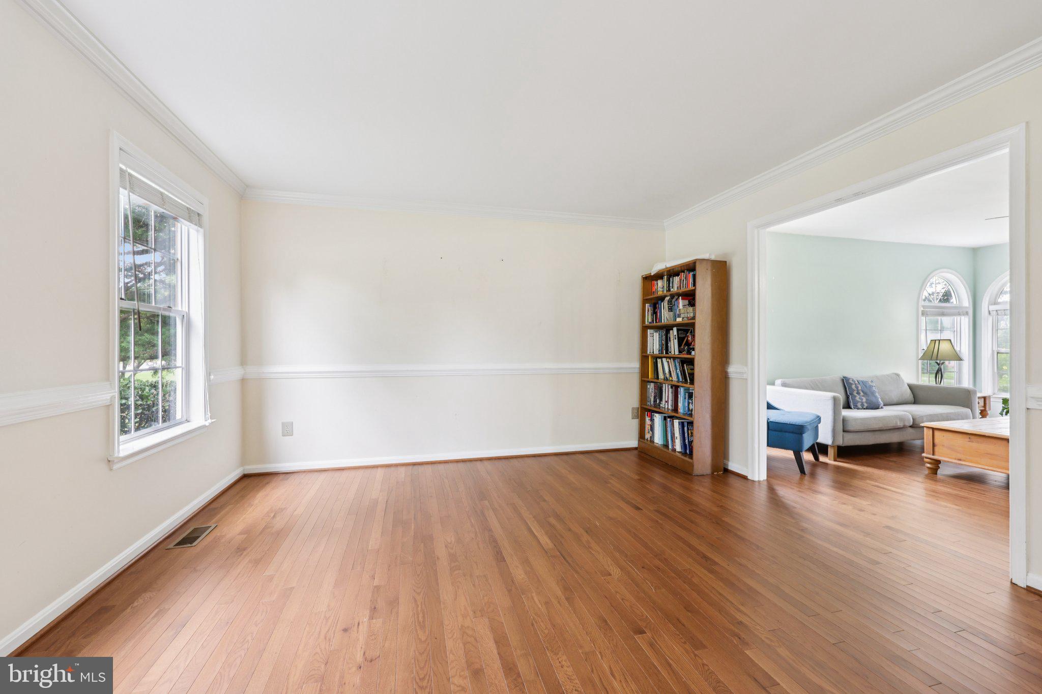 10457 Pineview Road Manassas, VA 20111 - Photo 4 of 55 a view of empty room with wooden floor and fan