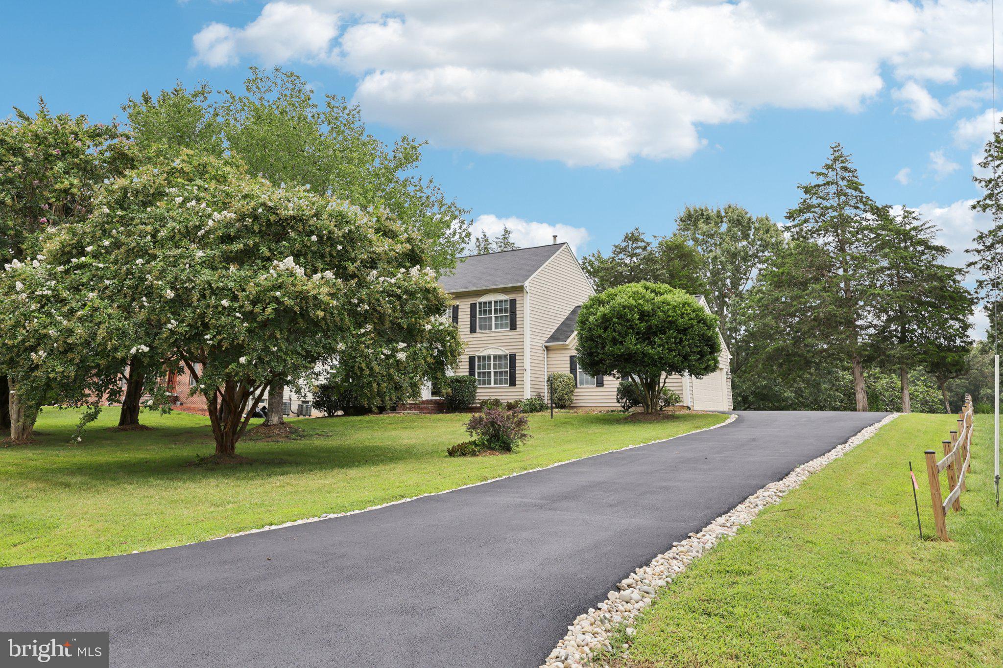 10457 Pineview Road Manassas, VA 20111 - Photo 51 of 55 a view of a house with a big yard and large trees