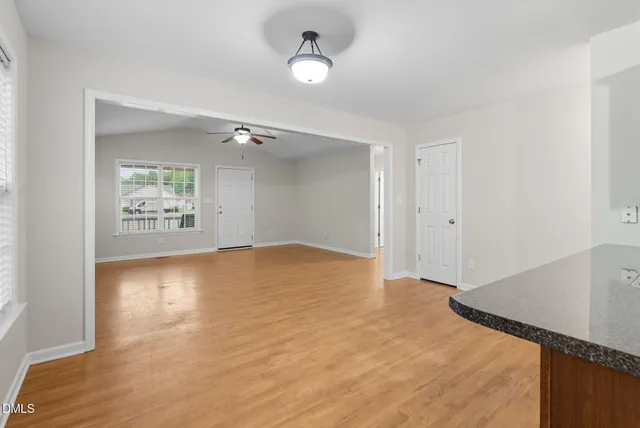 a kitchen with a sink a stove a microwave and cabinets