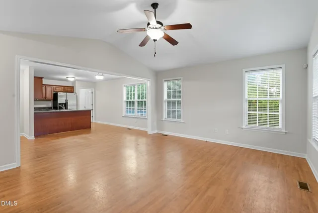 a view of a deck with wooden floor and fence