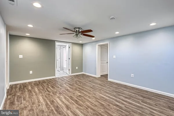 a view of an empty room with a chandelier