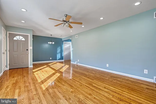 a kitchen with stainless steel appliances granite countertop a stove cabinets and a refrigerator