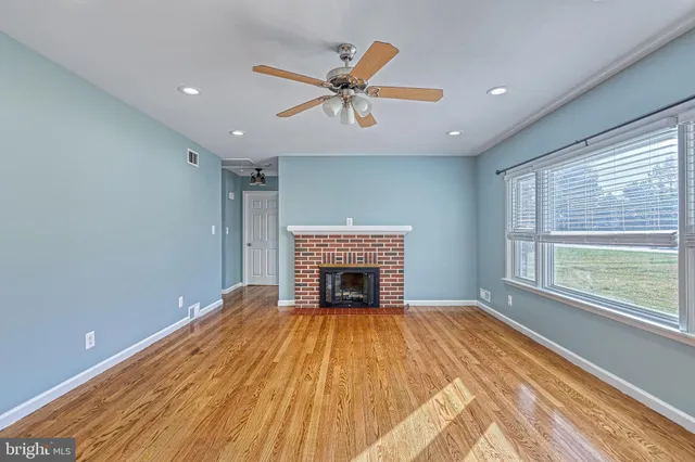 a kitchen with stainless steel appliances a refrigerator and a stove top oven