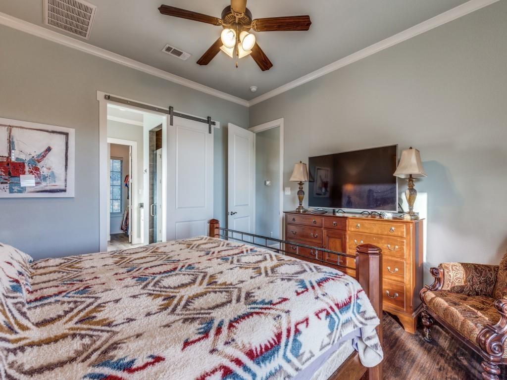 165 Cote D Azur Chico, TX 76431 - Photo 16 of 40 a bedroom with a bed and a flat screen tv