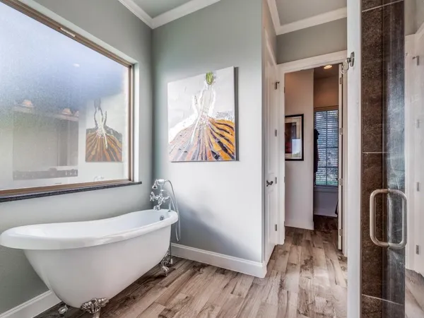 a bathroom with a bathtub and shower