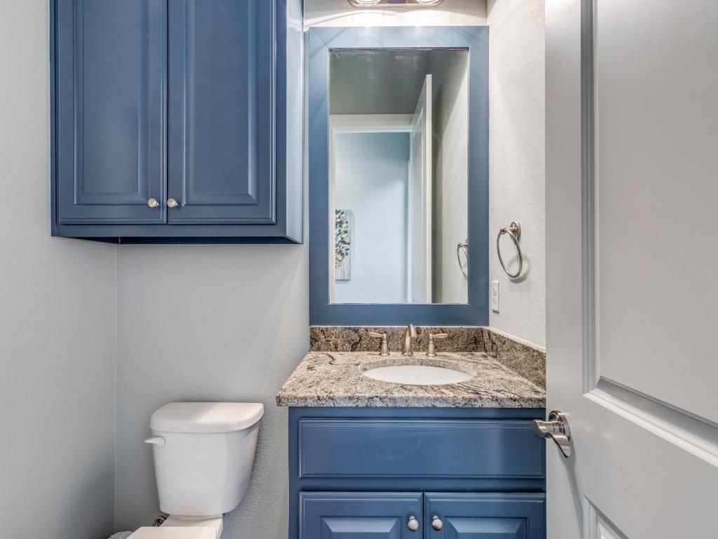 165 Cote D Azur Chico, TX 76431 - Photo 20 of 40 a bathroom with a granite countertop toilet and a sink