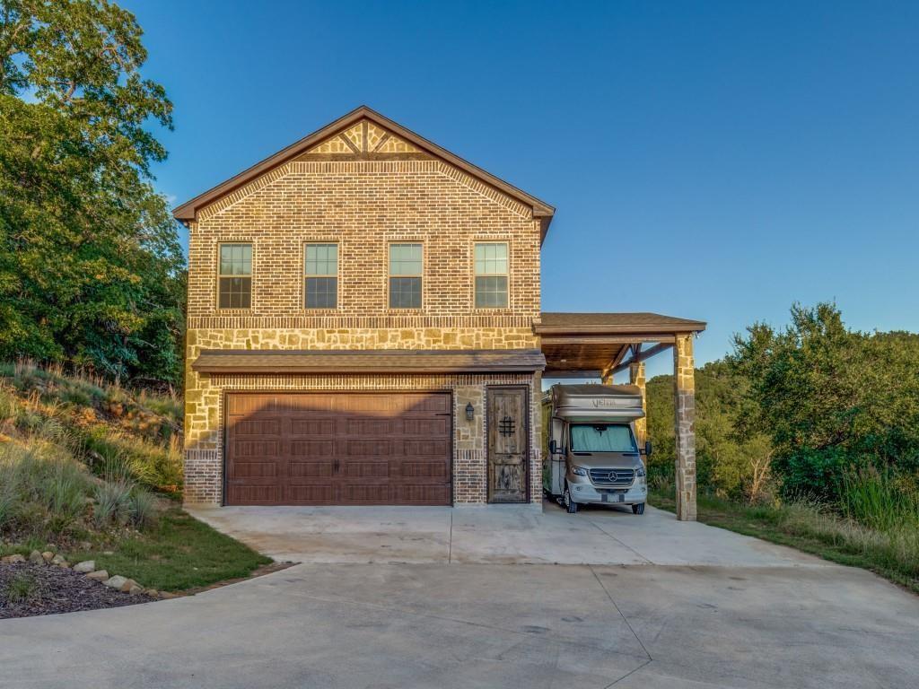 165 Cote D Azur Chico, TX 76431 - Photo 2 of 40 a front view of a house with a yard
