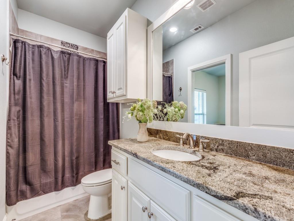 165 Cote D Azur Chico, TX 76431 - Photo 23 of 40 a bathroom with a granite countertop sink and a mirror