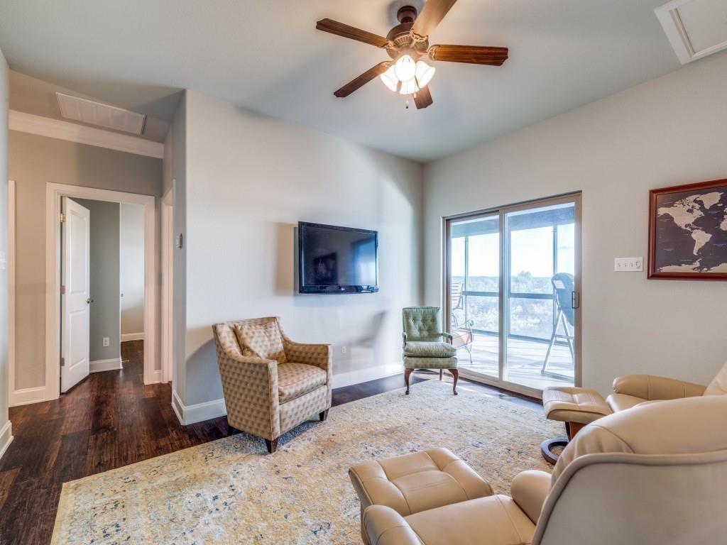 165 Cote D Azur Chico, TX 76431 - Photo 24 of 40 a living room with furniture and a flat screen tv