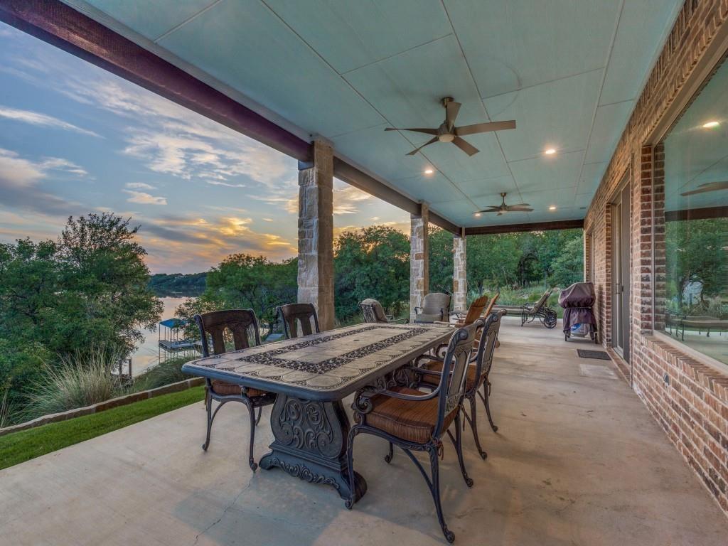 165 Cote D Azur Chico, TX 76431 - Photo 29 of 40 a view of a patio with a table chairs and a backyard