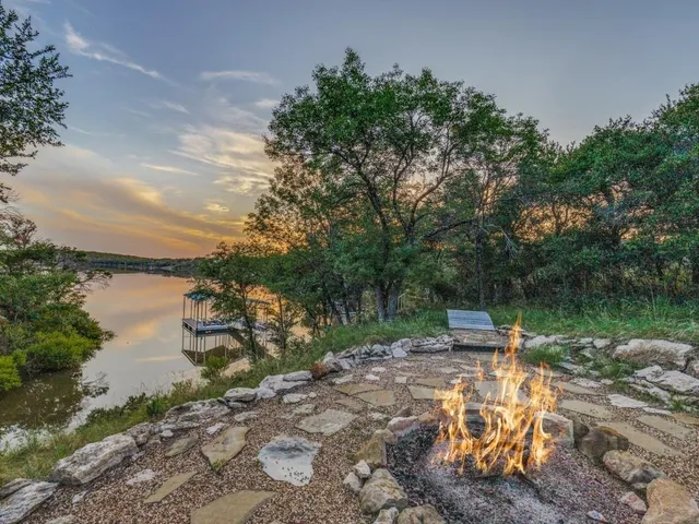 a view of a lake with outdoor seating