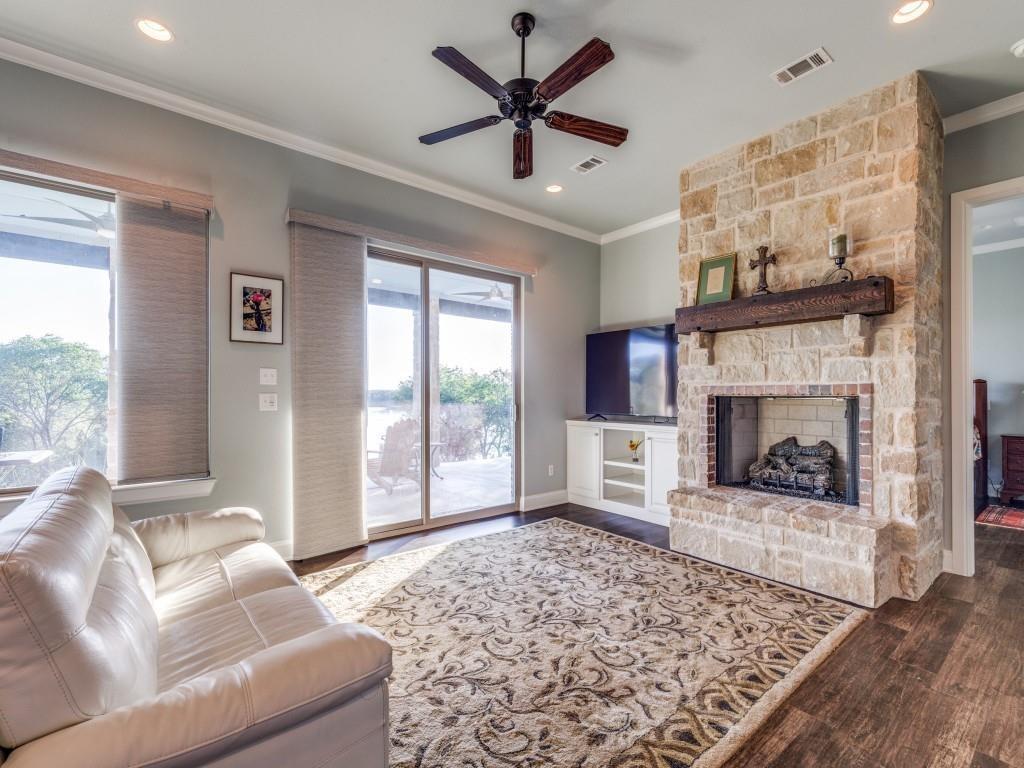 165 Cote D Azur Chico, TX 76431 - Photo 6 of 40 a living room with furniture and a fireplace