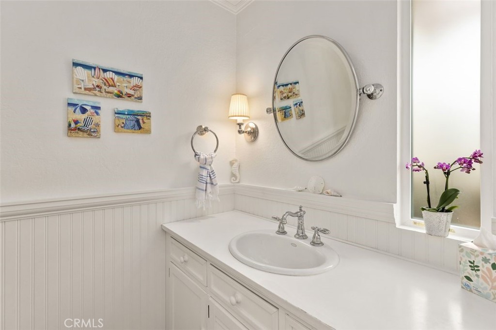33482 Spinnaker Drive South Dana Point, CA 92629 - Photo 11 of 27 a bathroom with a sink and a mirror