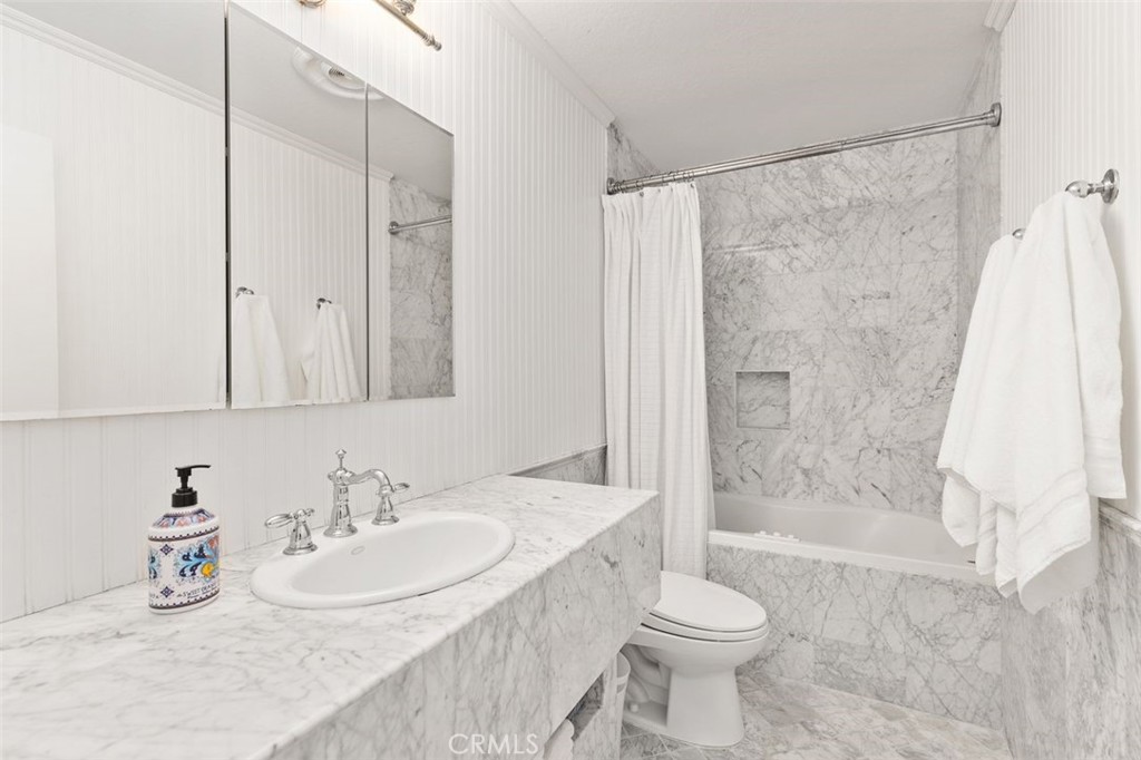 33482 Spinnaker Drive South Dana Point, CA 92629 - Photo 13 of 27 a bathroom with a sink and a toilet