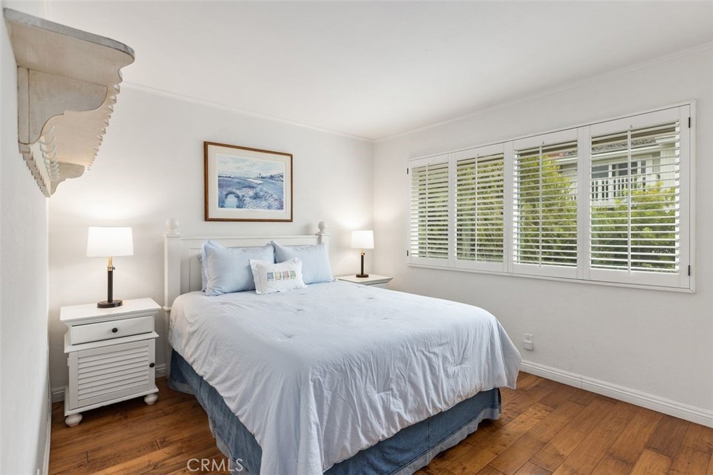33482 Spinnaker Drive South Dana Point, CA 92629 - Photo 14 of 27 a bedroom with a bed and a night stand