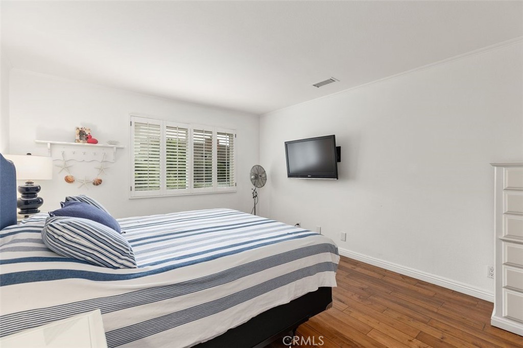 33482 Spinnaker Drive South Dana Point, CA 92629 - Photo 15 of 27 a bedroom with a bed and a flat screen tv