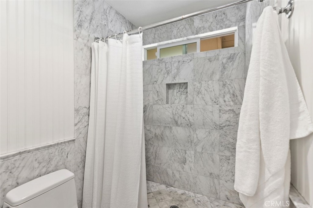 33482 Spinnaker Drive South Dana Point, CA 92629 - Photo 17 of 27 a bathroom with a shower curtain and a sink