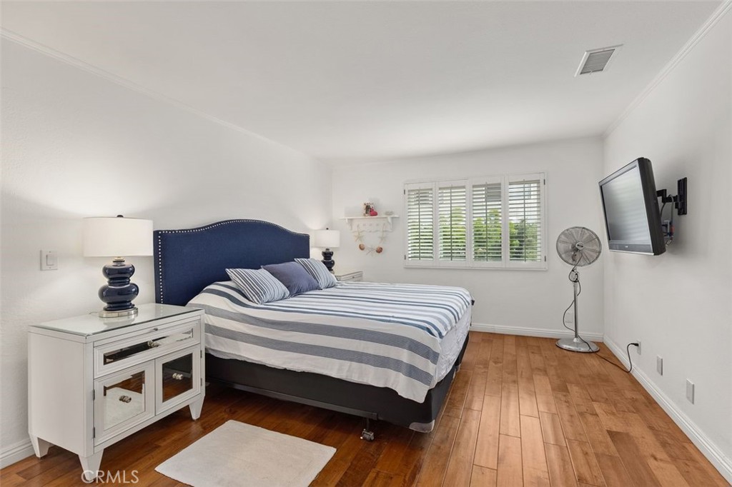 33482 Spinnaker Drive South Dana Point, CA 92629 - Photo 18 of 27 a bedroom with a bed and a window