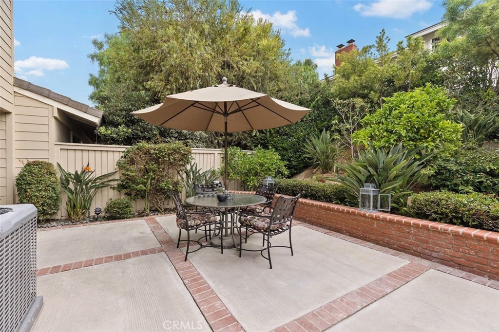 33482 Spinnaker Drive South Dana Point, CA 92629 - Photo 20 of 27 a patio with a patio table and chairs