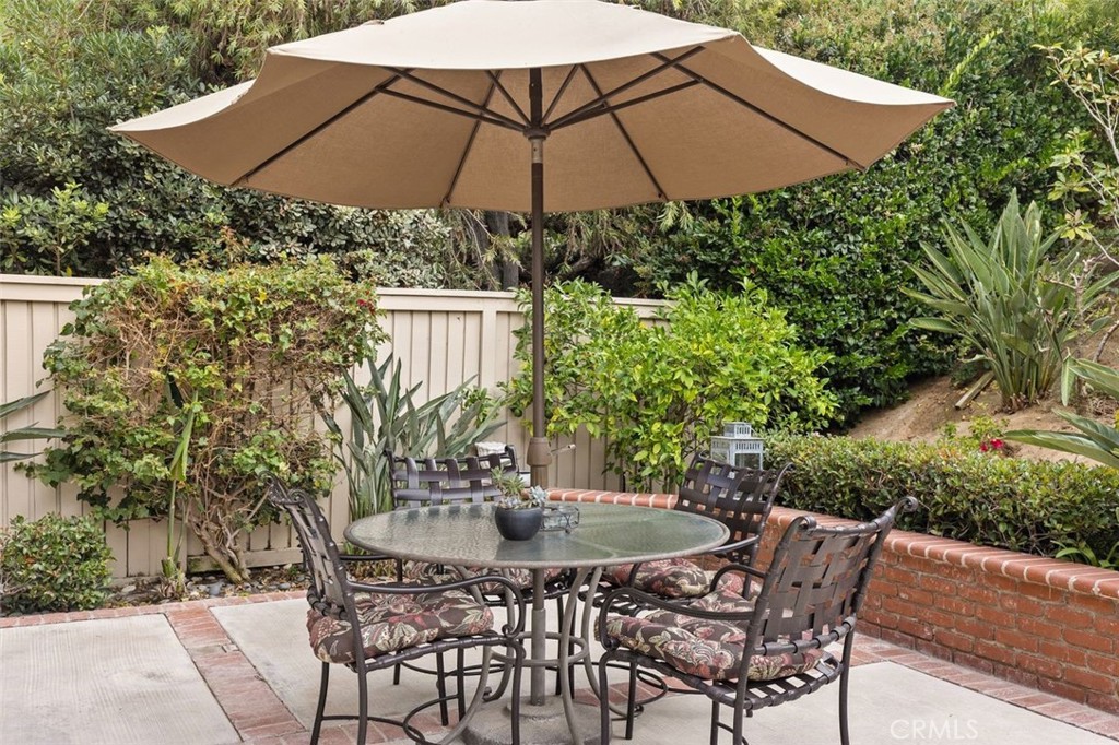33482 Spinnaker Drive South Dana Point, CA 92629 - Photo 21 of 27 a patio with a patio table and chairs
