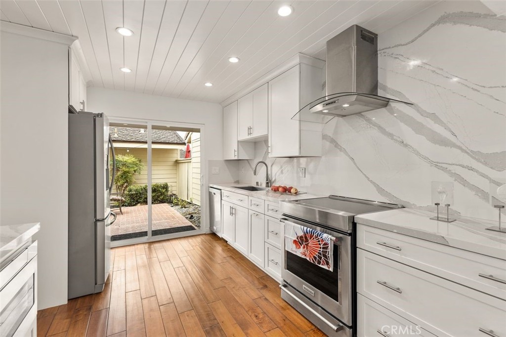 33482 Spinnaker Drive South Dana Point, CA 92629 - Photo 7 of 27 a kitchen with a sink and wooden floor