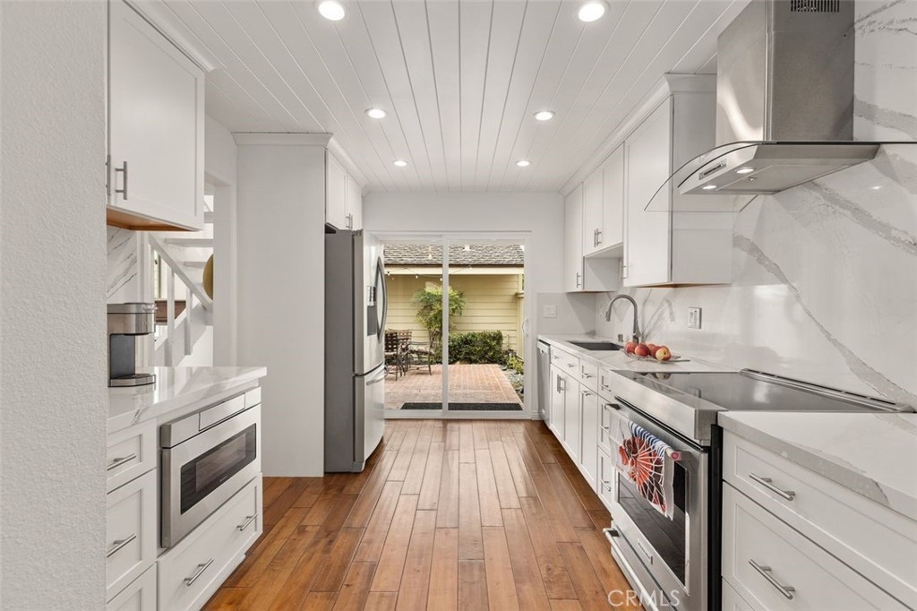 33482 Spinnaker Drive South Dana Point, CA 92629 - Photo 8 of 27 a kitchen with a sink and wooden floor