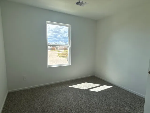 a bathroom with a granite countertop sink a toilet and shower