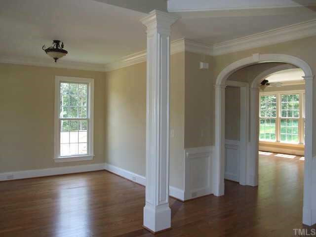 2605 Pathview Court Raleigh, NC 27613 - Photo 3 of 10 Impressive 2-story FOYER with elegant arched openings (notice the trim detail) into the Family Room. Other
