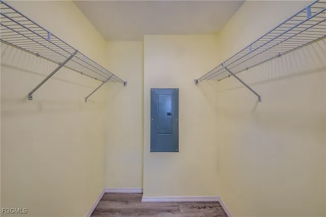 a bathroom with a granite countertop toilet sink and mirror