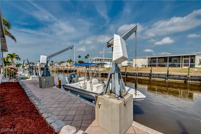 a view of house with swimming pool outdoor seating