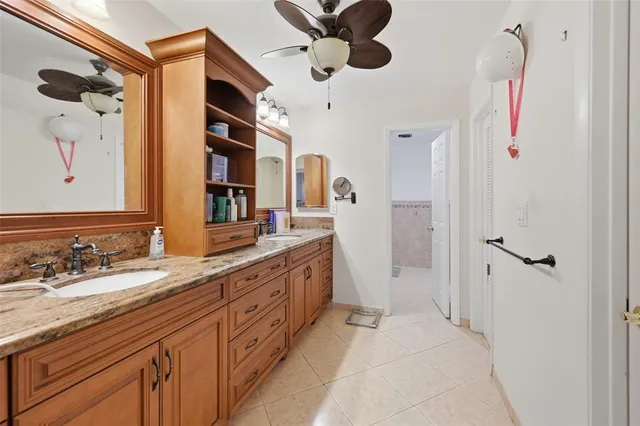 a spacious bathroom with a double vanity sink and a mirror