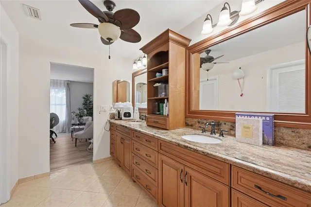 a bathroom with a double vanity sink and a mirror