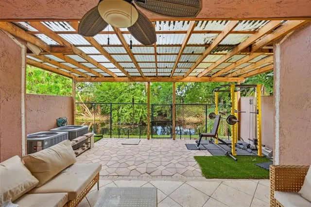 a view of porch with a table and chairs